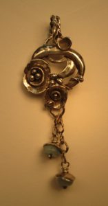 Warmed up, but yikes - it's sure yellow! This is with normal lightbulbs, directed at the pendant.